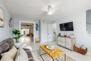 a living room with a couch and a table at Cozy Paradise in Marco Island