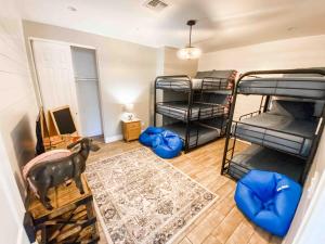 a room with four bunk beds and a room with a goat in it at The Phoenix Farmhouse in Phoenix +46 photos