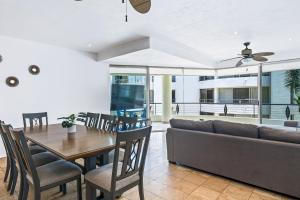 a living room with a couch and a table at Nitta Condo 109 in Nuevo Vallarta 