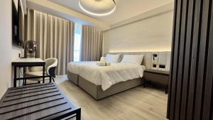 Postel nebo postele na pokoji v ubytování ASTE hotel