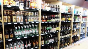a store shelf filled with lots of bottles of alcohol at Pemberton Hotel (Motel) in Pemberton