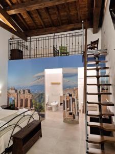 a bathroom with a staircase and a mural of a mountain at Diana'S in Fiumefreddo di Sicilia