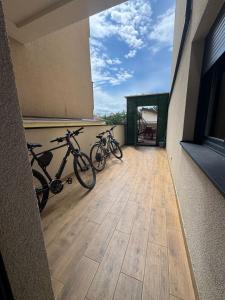 two bikes parked on a balcony of a building at Y apartman Zvezdara in Belgrade