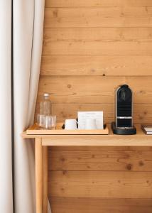 a wooden shelf with a coffee maker on it at Chalet Flachaire in Abondance +34 photos