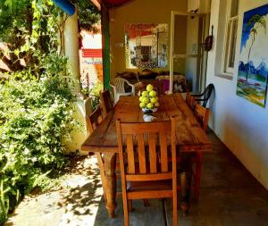 a wooden table with a bunch of fruit on it at Cathys Guesthouse 1 in Cradock