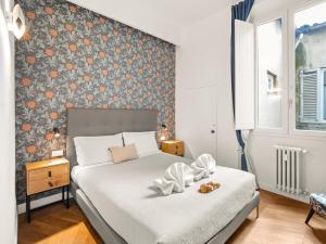 Ένα ή περισσότερα κρεβάτια σε δωμάτιο στο Four Season's Ghibellina Luxury Apartment 300 mt from Duomo