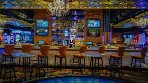 a bar with chairs and tables in a casino at Downtown Grand Hotel & Casino in Las Vegas