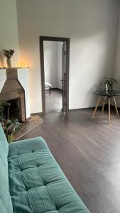 a living room with a couch and a fireplace at Cozy place in mountains of Ajaria in Kokhi