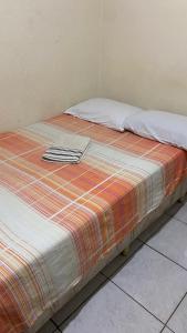 Postel nebo postele na pokoji v ubytování Pousada e Alojamento Engenho de Itaguaí