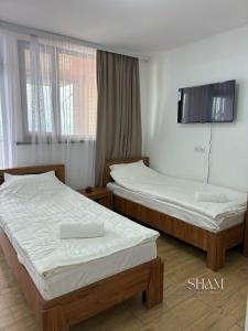 Guest house SHAM客房内的一张或多张床位