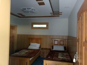 Postel nebo postele na pokoji v ubytování Kaghan Hills Resort