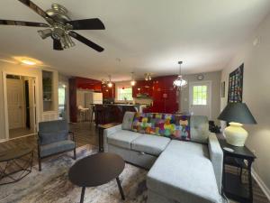 a living room with a couch and a table at Peace in the Holler in Eureka Springs