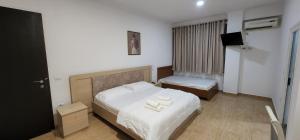 Voodi või voodid majutusasutuse Hotel Kleo toas