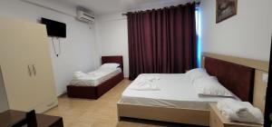 Voodi või voodid majutusasutuse Hotel Kleo toas