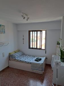 Posteľ alebo postele v izbe v ubytovaní An apartment in Xeraco with 3 bedrooms, located near beach and Gandia