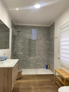 a bathroom with a shower and a sink at Blanco y Añil Plaza in Valdepeñas +105 photos