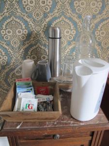 a wooden table with a bottle on top of it at ChezLola in Civray +13 photos