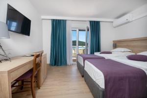 Postel nebo postele na pokoji v ubytování Hotel Porat