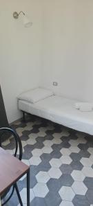 Postel nebo postele na pokoji v ubytování Benedetto XVI Firenze
