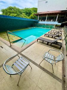Bazén v ubytování Hotel El Bosque Valledupar nebo v jeho okolí