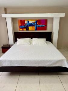 Postel nebo postele na pokoji v ubytování Hotel El Bosque Valledupar