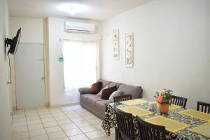 a living room with a couch and a table at House equipped with two bedrooms in La Paz