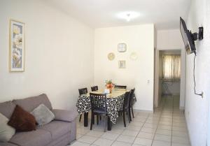 a living room with a table and a couch at House equipped with two bedrooms in La Paz