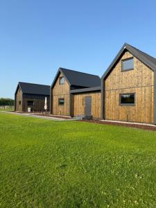 an image of a barn with a grass field at Łąkowe Wzgórze in Kosewko