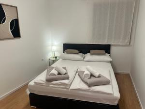 Postel nebo postele na pokoji v ubytování Apartman Obala deLuxe