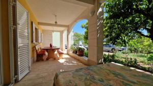 an outdoor patio with a table and chairs on a house at Dijana in Makarska