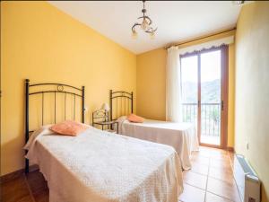 Postel nebo postele na pokoji v ubytování Live Villa Las Salineras