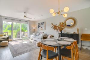 a living room with a table and chairs at Family-Friendly North Conway Home Near Skiing! in North Conway