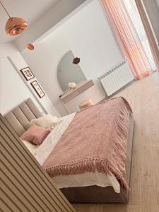 a bedroom with a large bed with a large mirror at Meraki Resort & Spa Isabellae Home in Mamaia Sat/Năvodari +58 photos