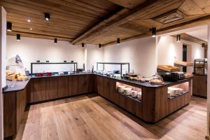 a kitchen with a counter with food on it at Apartments Butterfly Zermatt in Zermatt