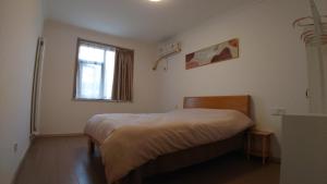 Postel nebo postele na pokoji v ubytování Lezhan B&B