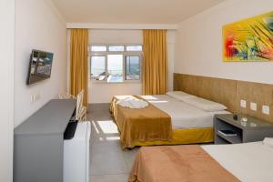 Postel nebo postele na pokoji v ubytování Yak Beach Hotel Natal + 37 fotografií