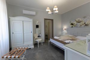 Letto o letti in una camera di Bed and Breakfast Arcobaleno