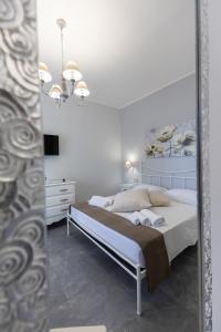 Letto o letti in una camera di Bed and Breakfast Arcobaleno