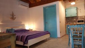 A bed or beds in a room at Casolare La Torre