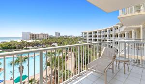 a balcony with a view of the beach and the ocean at The Crescent 306 in Destin