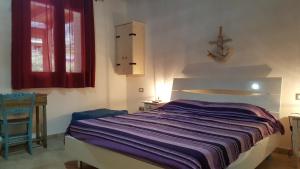 A bed or beds in a room at Casolare La Torre