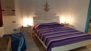 A bed or beds in a room at Casolare La Torre