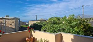 a view of a city from a balcony at Emvassis Art Nil in Elefterna
