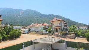 a view of a town with houses and a mountain at Oludeniz Villa with Private Pool in Fethiye