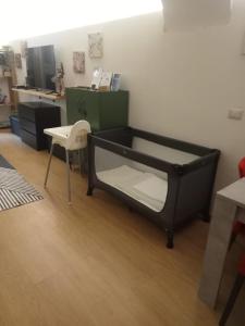 a bed in a room with a desk and a chair at Santa Barbara Apartment in Catania