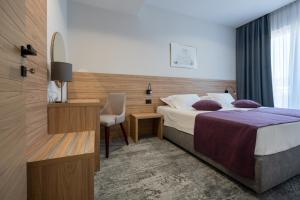 Postel nebo postele na pokoji v ubytování Hotel Porat