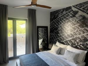 Postel nebo postele na pokoji v ubytování Miliša residence