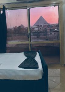 Letto o letti in una camera di Happy pyramids view