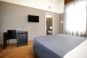 Postel nebo postele na pokoji v ubytování Piazza Carità