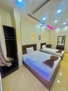 Letto o letti in una camera di Happy pyramids view